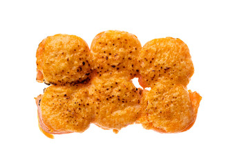 sushi and rolls with different toppings in eight pieces close-up on a white background top view