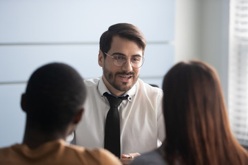 Caucasian bank manager makes financial offer to multiracial spouses