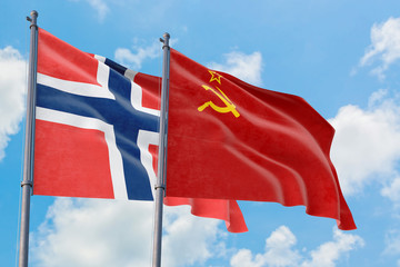 Soviet Union and Bouvet Islands flags waving in the wind against white cloudy blue sky together. Diplomacy concept, international relations.