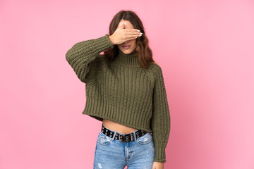 Young woman over isolated pink background covering eyes by hands. Do not want to see something