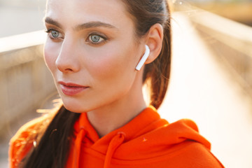 Amazing sports fitness woman listening music