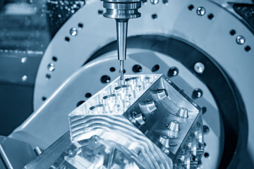 The 5-axis CNC milling machine  cutting the aluminium V8 engine block  by solid ball endmill tools...