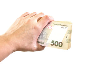 hryvnias in hand isolated on white background.