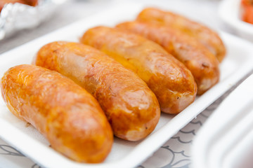 Close up of homemade sausages baked in an oven on Oktoberfest