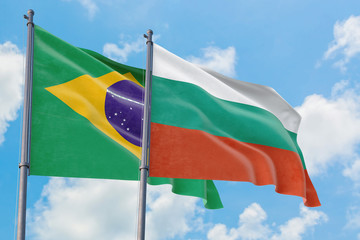 Bulgaria and Brazil flags waving in the wind against white cloudy blue sky together. Diplomacy concept, international relations.