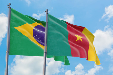 Cameroon and Brazil flags waving in the wind against white cloudy blue sky together. Diplomacy concept, international relations.