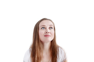 Close-up headshot of young natural pensive  woman with long hair and natural make-up, female smiling and looking away