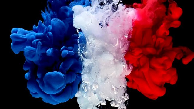 France flag made of colored ink on a black background. Stylish abstract modern background. Blue, white and red watercolor ink in water. A powerful explosion of colors. Cool trending screensaver.