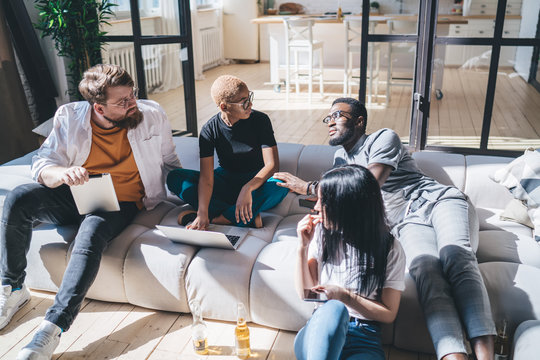 Group of cheerful friends during discussion - Powered by Adobe