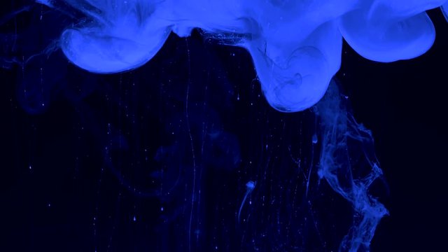Beautiful blue phantom background. Neural networks. Stylish abstract modern space background. Blue watercolor ink in water on a black background. Cool trending screensaver.