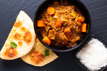 Oriental food concept spicy grounded or minced beefs masala curry with naan bread and rice