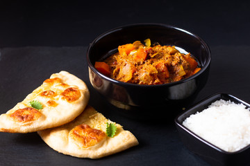 Oriental food concept spicy grounded or minced beefs masala curry with naan bread and rice