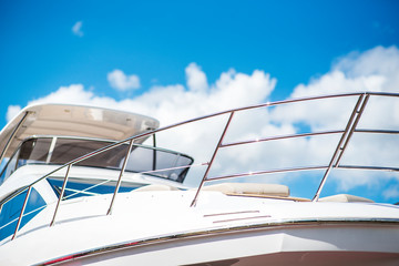 Nautical background of luxury yachts, with black tinted windows and chrome metal railings on white...