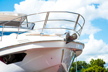 Nautical background of luxury yachts, with black tinted windows and chrome metal railings on white...