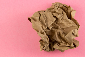 Crumpled paper texture or background,on a pink background . copyspace for text