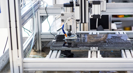 CNC turning, drilling and boring machine at work close-up. Industry, industrial concept.