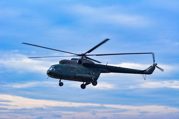 Naklejka na ściany i meble Military helicopter flying