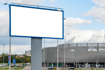 Blank white advertising billboard in front of sport stadium