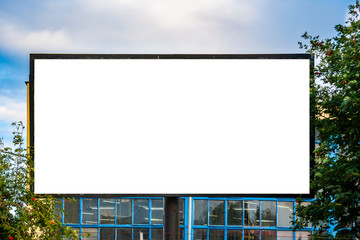 Blank advertising billboard mockup in front of industrial building