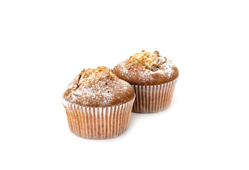 Cupcakes sprinkled with powdered sugar on a white background