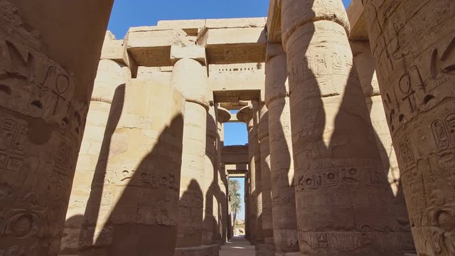 Karnak Temple in Luxor, Egypt. The Karnak Temple Complex, commonly known as Karnak, from Arabic Khurnak meaning fortified village , comprises a vast mix of decayed temples, chapels, pylons, and other 
