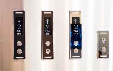 Different buttons in modern metal elevator