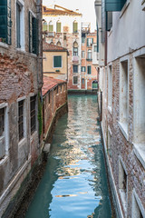 Fototapeta na wymiar Art and reflections along the calli of Venice. Italy