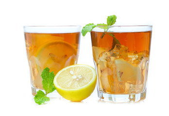 iced tea with lemon slices and mint on white background