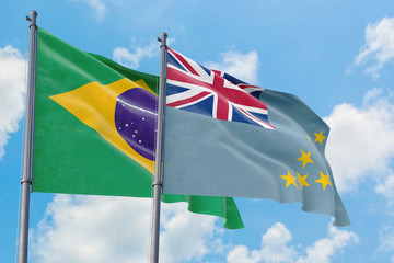 Tuvalu and Brazil flags waving in the wind against white cloudy blue sky together. Diplomacy...