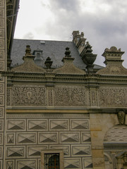 The top and roof of the building with geometric and floral ornaments