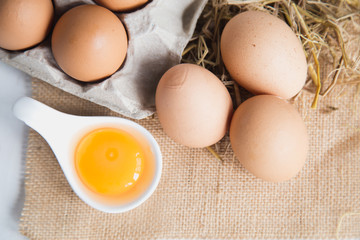 Eggs chicken on white wood background
