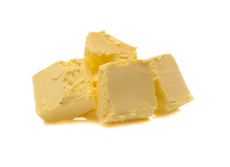 Pieces of butter isolated on white background