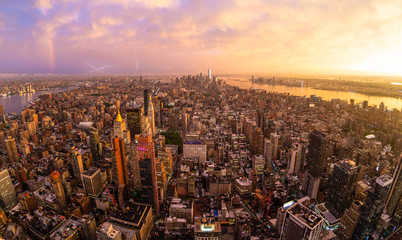 New York City skyline with Manhattan skyscrapers at dramatic vibrant after the storm sunset, USA....
