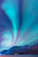 Northern lights (Aurora borealis) in the sky over Tromso, Norway - obrazy, fototapety, plakaty