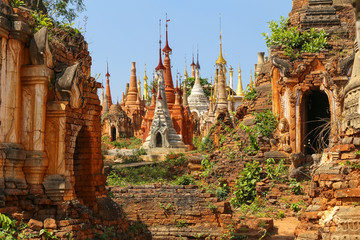 Semi dilapidated and restoted stupas of ancient pagodas in Myanmar