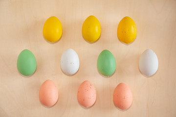 Colorful easter eggs on wooden background