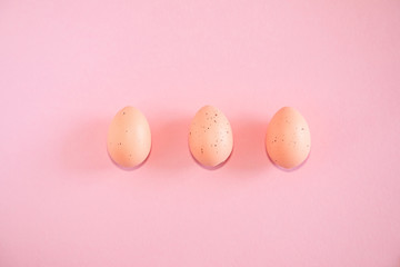 Pink easter eggs on pink background