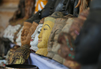 A lot of bright souvenirs on the counter of the ancient souvenir market in Myanmar