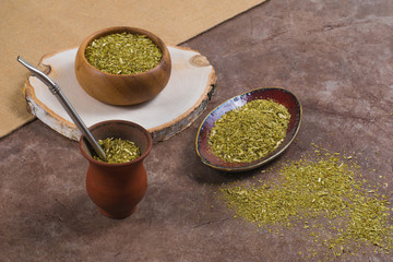 Traditional South American yerba mate in porongo and in bowls