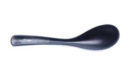 plastic black spoon, isolated on white background