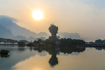 Sunrise on the lake in Hpa-an in the background of mountains of Myanmar