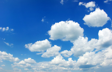 Blue sky background with tiny clouds