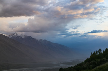 The valley of the Pyandzh River at dawn in the rays of the rising sun, on the border with Avganistan