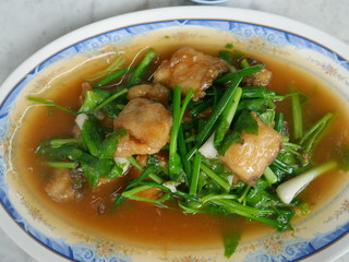 dish of fish with vegetables on the table