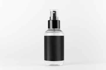 Transparent spray bottle for cosmetics product with black blank label on white background, mock up for branding, advertising, presentation, design.