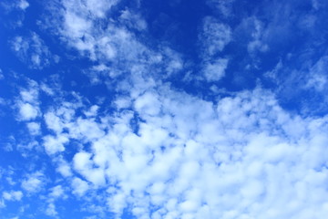 Blue sky with nice weather clouds 