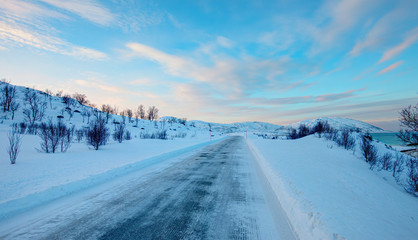 Fototapeta na wymiar Beautiful winter landscape with snow and ice covered road - Tromso, Norway - Arctic landscape