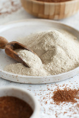 Teff flour in a plate with a spoon