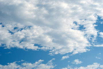 Blue sky with picturesque, white and gray clouds