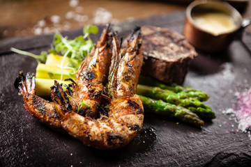 Tasting menu. Beef steak and grilled tiger prawns.